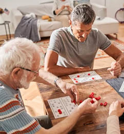 A man and a woman are playing a game of cards on a wooden table. AI generated content