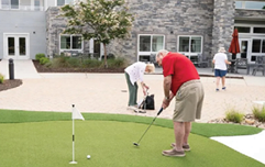 A man in a green shirt is playing golf on a green course. AI generated content